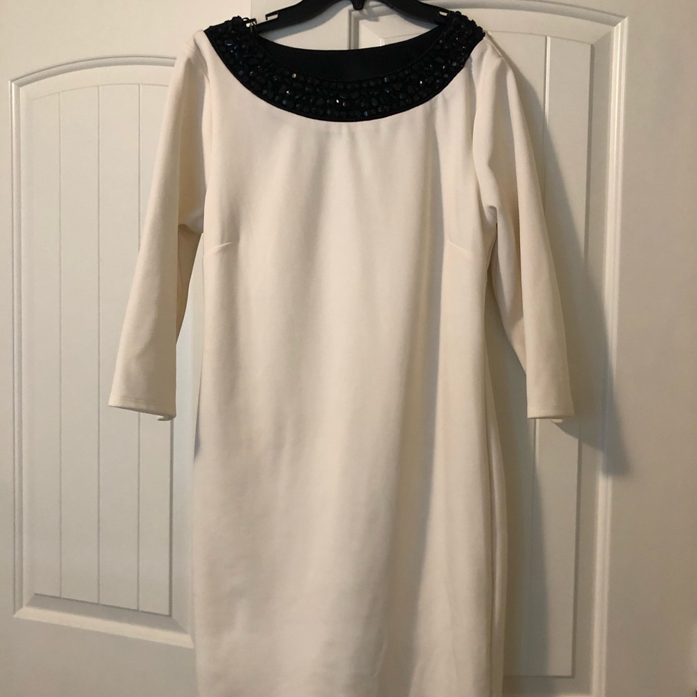 White dress. Black accent on top.